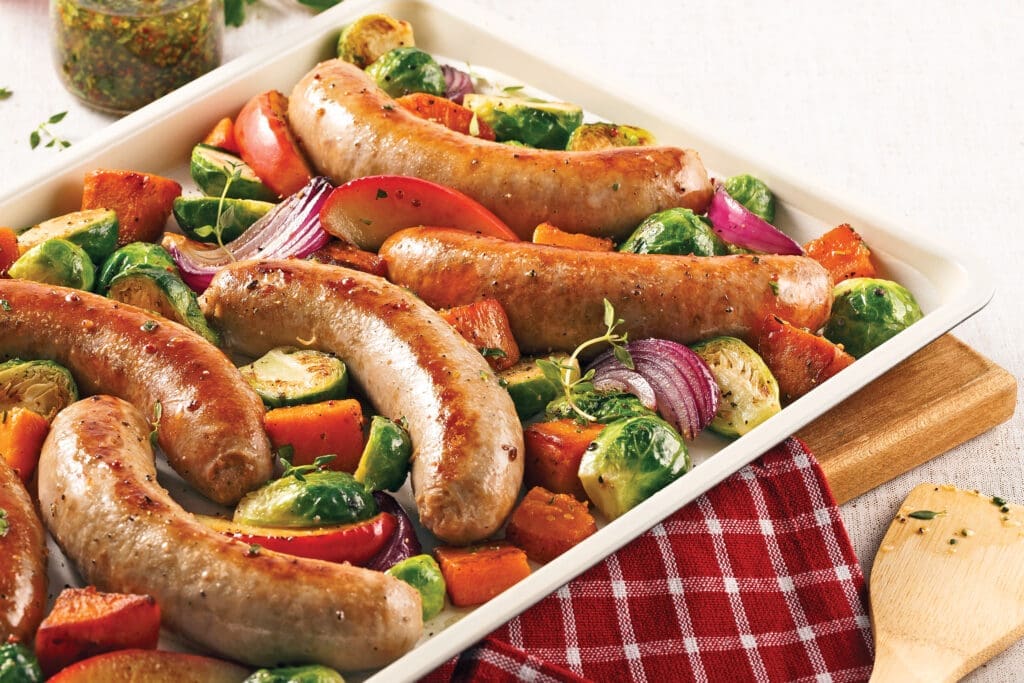 Sausages sweet potato and Brussels sprouts on the plate
