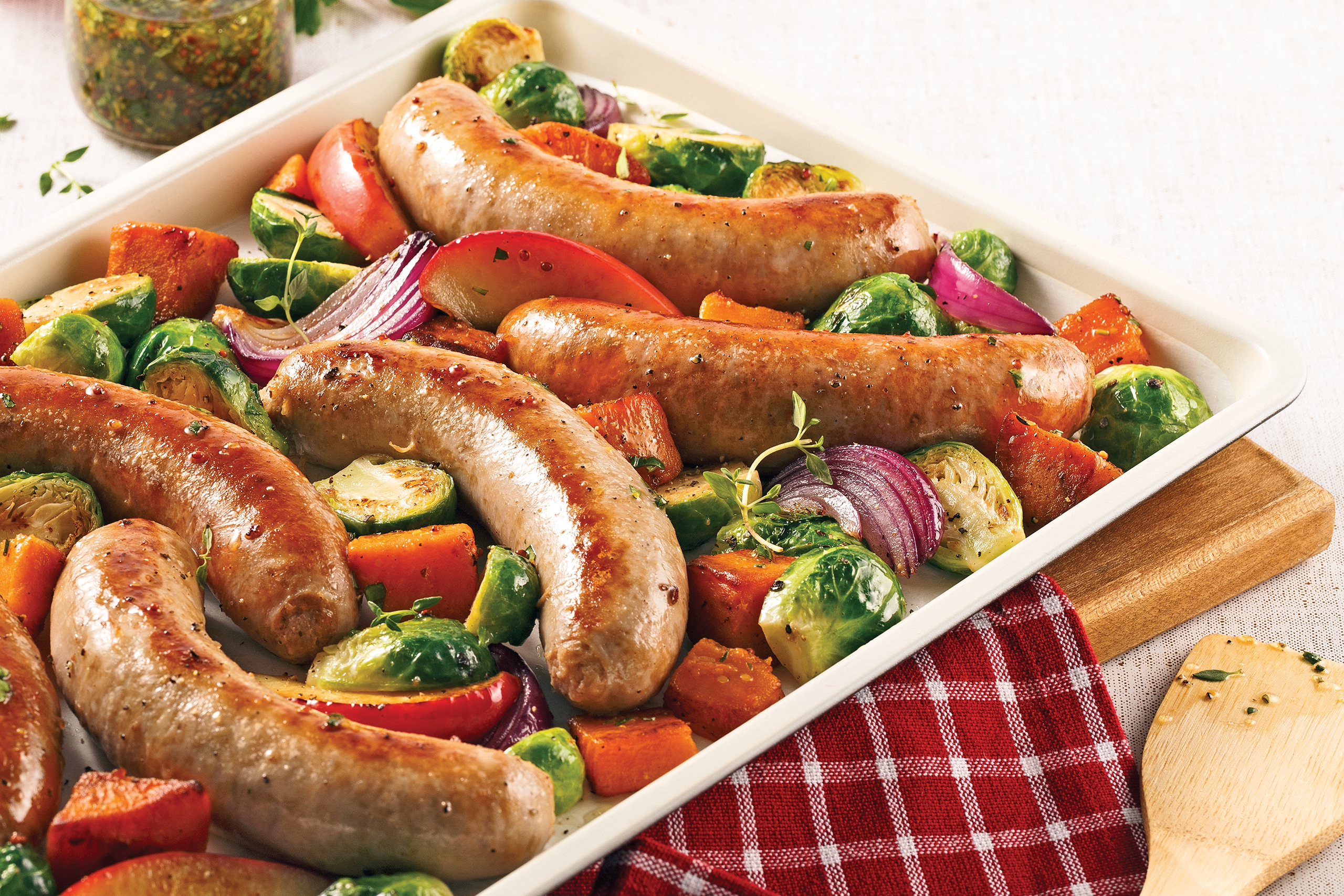 Sausages sweet potato and Brussels sprouts on the plate